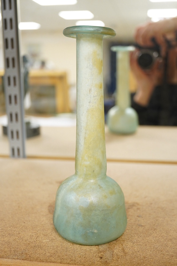 A Roman iridescent green glass bottle, 20cm. Condition - fair to good